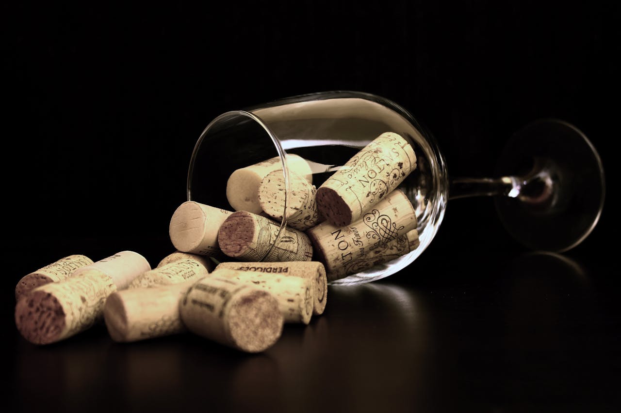 Wine corks spilling from a glass in a close-up arrangement.
